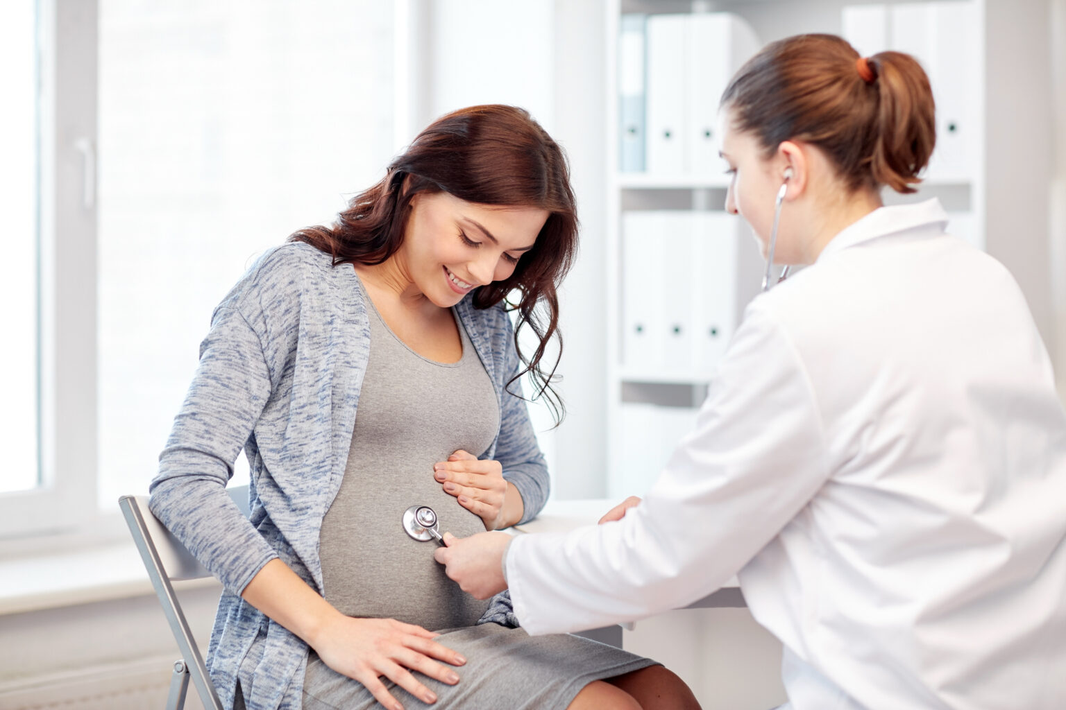 gynecologist doctor and pregnant woman at hospital