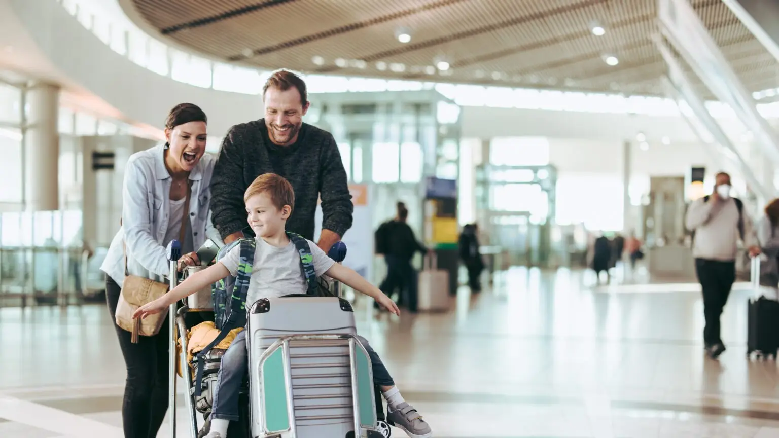 family travels in airport