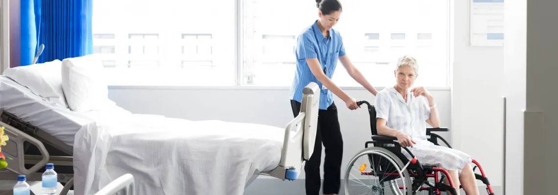 female patient in wheelchair on hospital ward australia